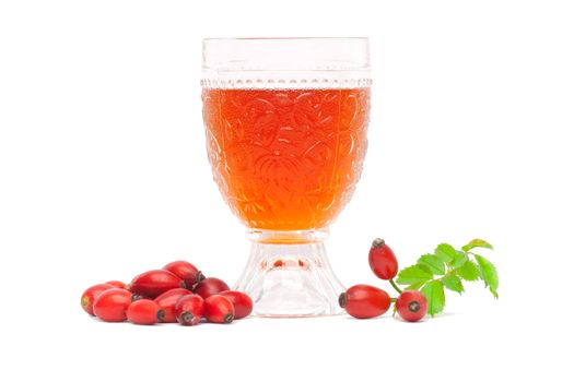 Rosehip wine with berries and leaves on a white background.