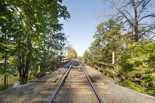 Train Track on Wooden Bridge over River in Oregon