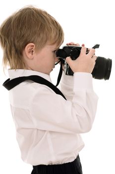 The child in a white shirt with the camera isolated on white background
