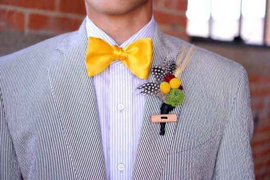 Image of a Seersucker Suit with yellow bowtie and boutonniere