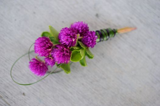 Image of a creatively designed  boutonniere