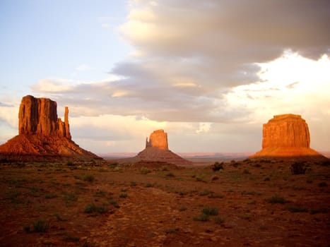 Sunset lights up the rock formations at Monument Valley