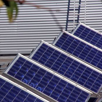 System of many blue solar panels on the roof