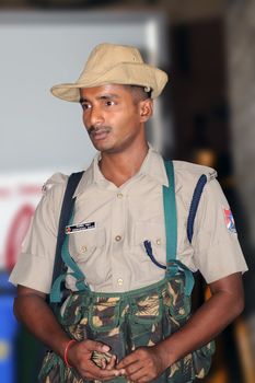 An Indian security gusard posted at a train station to patrol terrorists