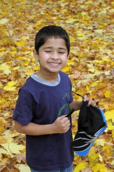 An handsome Indian kid smiling nicely for you