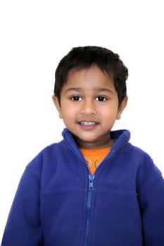 An handsome Indian kid smiling nicely for you