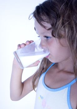 Cute girl with glass of milk