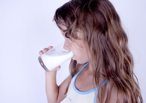 Cute girl with glass of milk