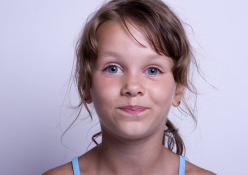 Cute girl with glass of milk