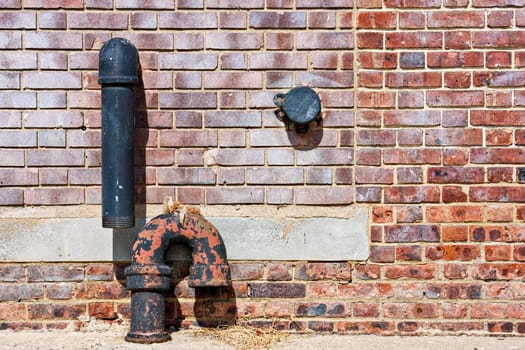 Abstract of brick wall and pipes