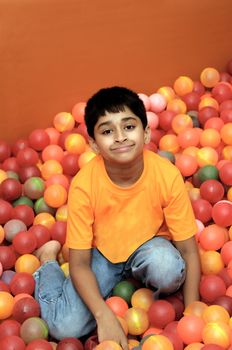 An handsome Indian kid having fun at a birthday party