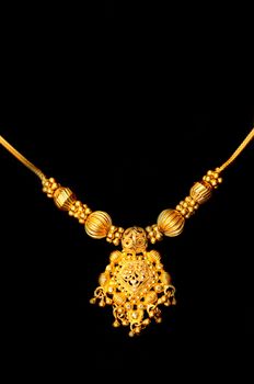 Beautiful Indian artwork displayed at a golden pendant