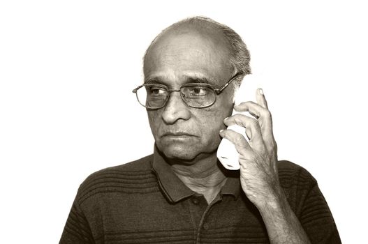 Old Indian Immigrant making a telephone call
