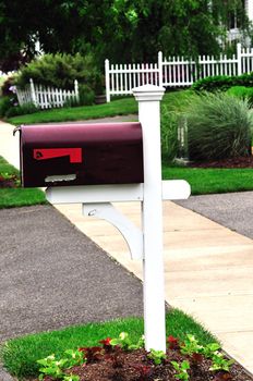 a beautiful red metail mail box at an american home