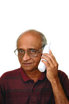 Old Indian Immigrant making a telephone call