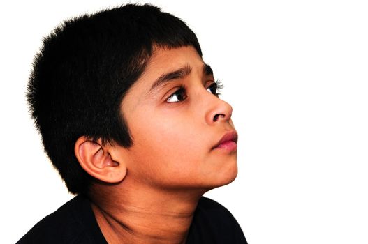 An handsome Indian kid awestruck watching television