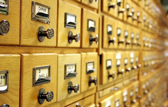 Closeup of card catalogue, showing several drawers