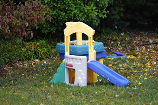 Colorful slide on the backyard of a house 