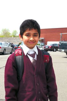 An handsome Indian kid ready to go to school