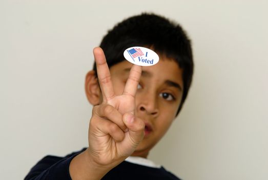 A kid holding the vote sign symbol of election in America
