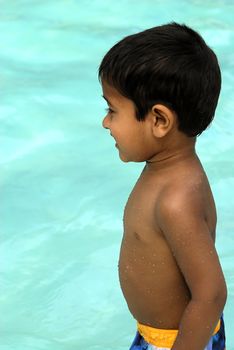 An handsome Indian kid having fun at a tropical beach