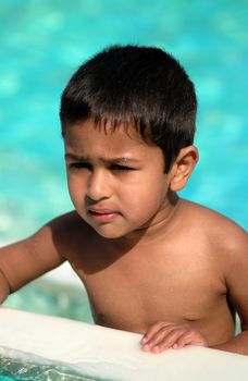 An handsome Indian kid having fun at a tropical beach