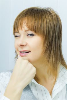 portrait of an attractive girl winking. Close-up
