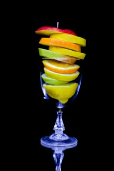 Fruit cocktail composition isolated on black background
