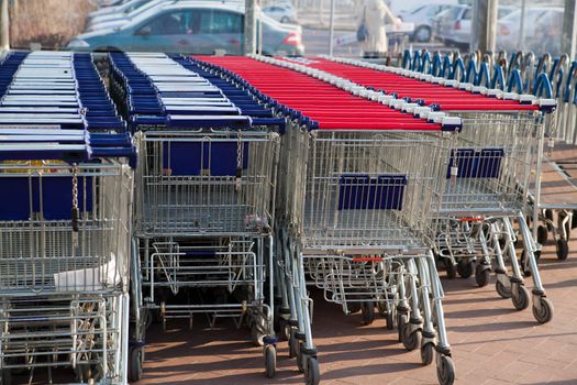 Row of empty shopping carts at the supermarket
