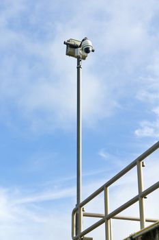 Dome CCTV camera against the blue sky