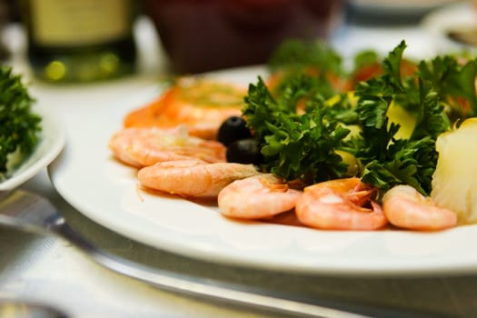 Sea Food mini set with shrimps on table macro shot