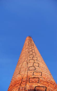 red bricks chimney and blue sky background