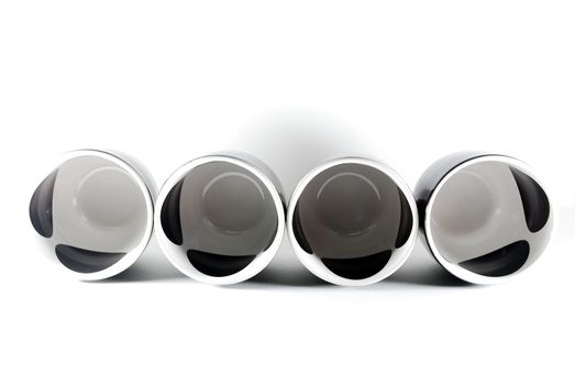 Black cups arranged on a white background.
