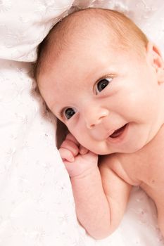 Baby girl in the age of one months isolated on white