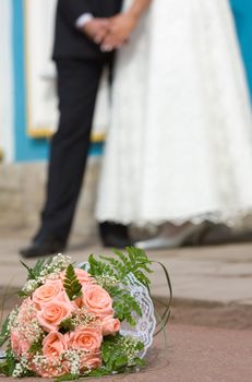 Bride's bouquet new married couple holding hands