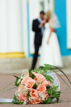 Bride's bouquet new married couple holding hands