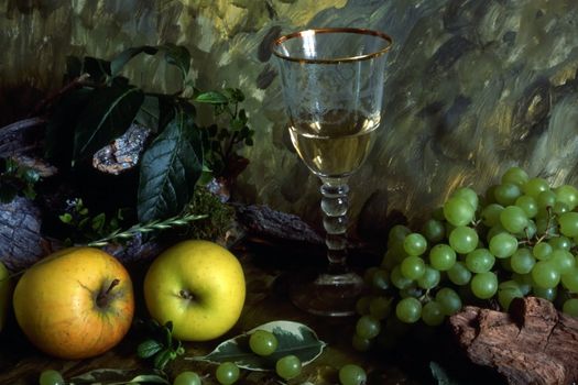 white wine with fruits on painted background