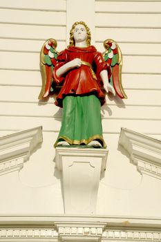 Wooden figure on the fasde old house in Bergen, Norway