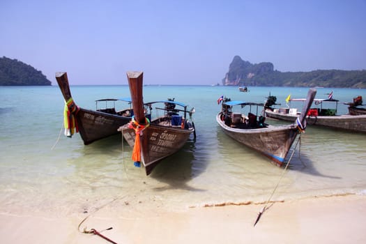 Small boats in Thailand phiphi island. Blue sky and sea