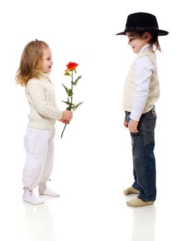 boy giving rose for his little girlfriend isolated on white