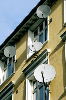 Satellite plates on a residential building facade