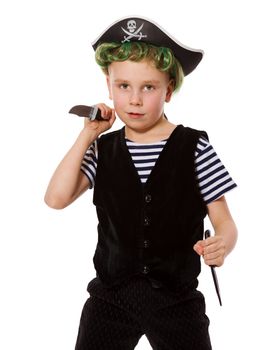 Boy wearing pirate costume holding knifes isolated on white