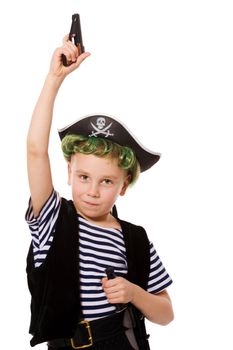 Boy wearing pirate costume shooting pistol isolated on white