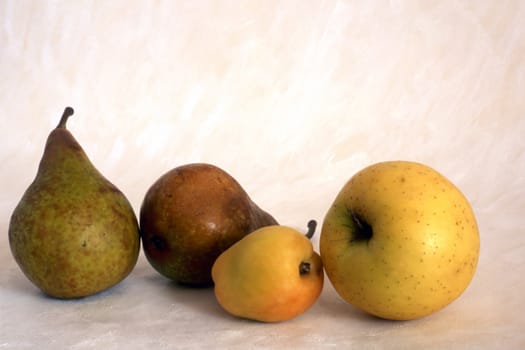 Pears and apples isolatedon painted background