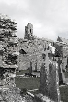 ancient celtic crosses in the graveyard of an old irish church
