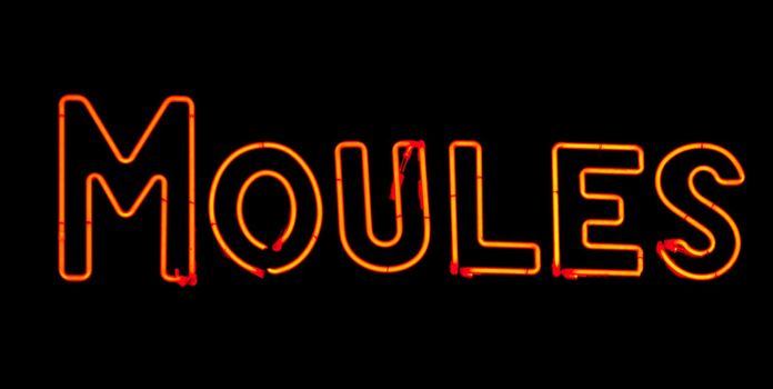 Mussel neon sign in red on black background in France