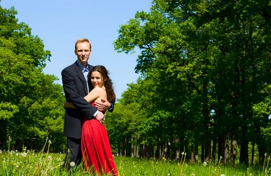 Happy young couple spending time together outdoors