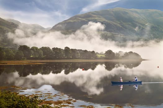 Low cloud drifts down the mountain to Loch Etive in Argyll and Bute, Scotland.