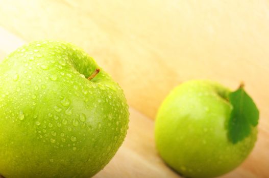 green apple on wood with copyspace showing healthy food concept