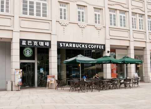 Xiamen, China - September 25:  A new Starbucks coffee shop near the popular tourist destination of Gulangyu opens in the city of Xiamen, China.  Currently it is the largest in all of China.